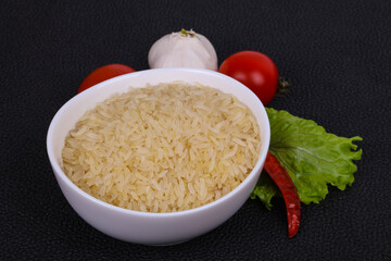 Raw uncooked rice in the bowl