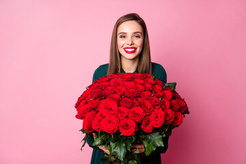 Photo of charming attractive lady red bright lipstick enjoy large hundred roses bouquet boyfriend 8 march present wear green dress isolated pastel pink color background