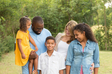 Portrait of a multi ethnic family laughing.