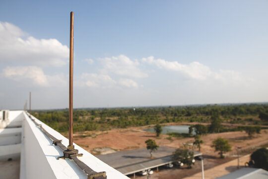 Copper lightning rods on tall buildings to prevent lightning strikes