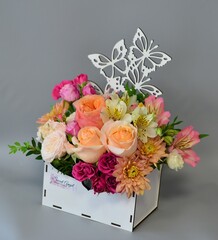 
wooden boxes with fresh flowers