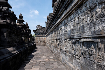 Fototapeta premium The stories from Mahayana Buddhist Sutras carved on the relief panels of Borobudur Temple (750AD)