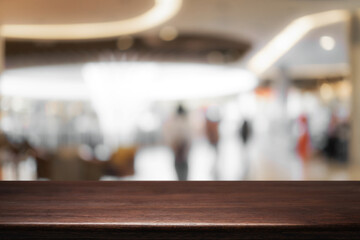 Empty desk platform over car department store background. For product display montage.