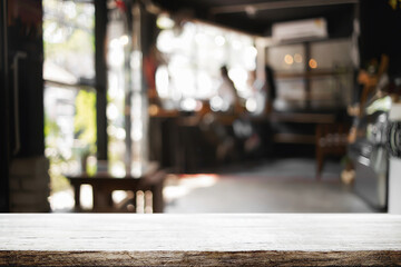 Empty desk platform over cafe background. For product display montage.