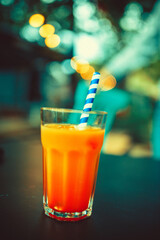 Glass of Aperol Spritz and blue straw, Italian Cocktail