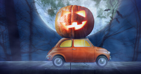 Halloween car delivering pumpkin against night scary autumn forest background. Spooky Jack o'Lantern ghost in on top of halloween vehicle.