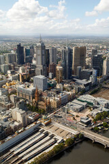 Naklejka na ściany i meble Cityscape of Melbourne central from the Eureka Sky Tower including Flinders Street Station and Federation Square.