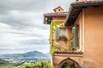 View of the house and mountains in the Italian city of Bergamo. Upper town. Lombardy, Italy