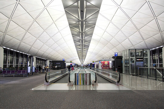 Hong Kong, China: April 07, 2017: Moving walkway at  Hong Kong International Airport. Located on the island of Chek Lap Kok, which comprises of land reclaimed for the construction of the airport.