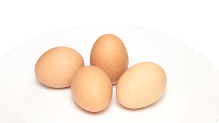 Chicken egg in white plate isolated on white background