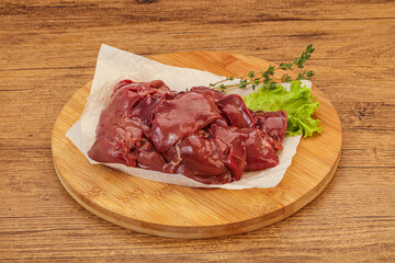 Raw chicken liver over board