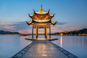 Fototapeta premium Jixian Pavilion and sunset in West Lake of Hangzhou