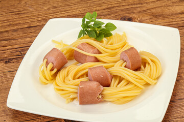 Kids pasta spaghetti with sausages