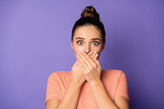 Portrait of astonished girl realize she share confidential novelty impressed hide her lips palm wear good look clothes isolated over purple color background