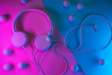 Old headphones on a colored background. Minimalism concept.
