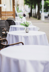 row of empty outdoor cafe