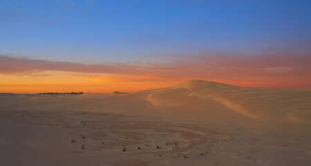 Fototapeta na wymiar a beautiful sunset over the sand dunes