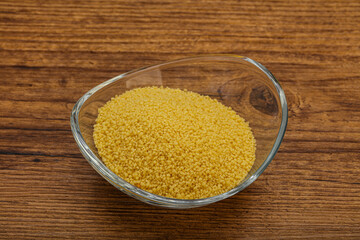 Raw cous cous heap in the bowl