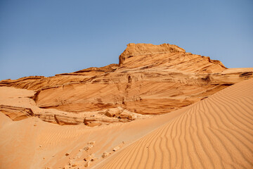 Fototapeta na wymiar Desert Background Landscape, Desert and beautiful blue sky. Horizon of the desert. Endless desert plain