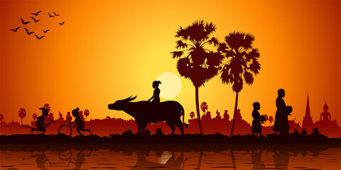 Country life of Asia children play banana horse ride buffalo while monk receivex food.  Sunrise time silhouette style - obrazy, fototapety, plakaty