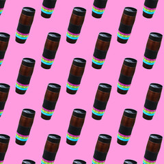 Pattern with a thermocup. Background with thermos. A bottle on a pink background.