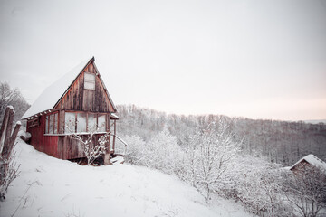 Beautiful winter views in mountains. Still life photography shoots. Old house in winter forest.