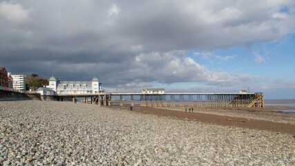 Fototapeta premium Low tide at the Victorian era Penarth Pier in the Vale of Glamorgan - Wales. Opened in 1894.