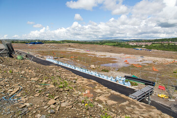 Ground being prepared for the construction of a housing estate on reclaimed land. Estimates have put the number of new homes needed in England and Wales at between 240,000 and 340,000 per year - 2019.