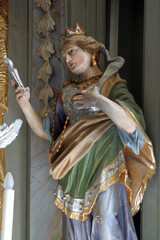 Obraz premium Saint Apollonia statue on the main altar at St. Catherine of Alexandria Church in Samarica, Croatia