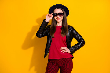 Portrait of her she nice-looking attractive lovely fashionable well-dressed cheerful cheery straight-haired girl touching specs posing isolated over bright vivid shine vibrant yellow color background