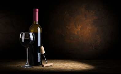 Fototapeta na wymiar the still life with red wine, bottle, glass and old barrel