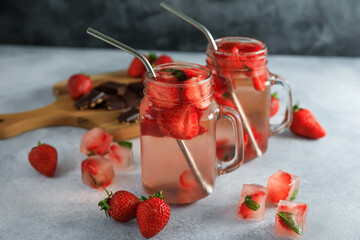 Strawberry drink with berriesand wooden board with chocolate. Diet drink, healthy concept