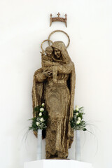Virgin Mary with baby Jesus statue on the main altar in the parish church Virgin Mary Queen of Peace in Granesinski Novaki, Croatia