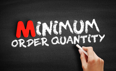 Minimum Order Quantity text on blackboard, business concept background