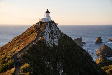 Fototapeta na wymiar A part of Nugget Point is one of the most beautiful landforms along the Otago coast of New Zealand with a lighthouse and a scattering of rocky islets.