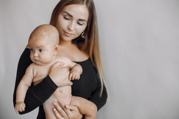 Mother with cute daughter. Blonde with long hair.