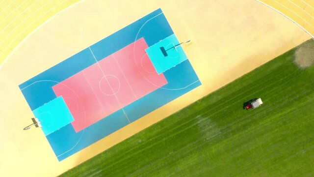 Basketball court on stadium from above. Aerial view to playground.