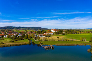 Obraz premium Aerial view of Schlehdorf monastery with parish church St. Tertulin on Kochelsee, Schlehdorf Upper Bavaria, Bavaria, Germany