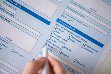 Woman filling employment contract, noting your parmanent, contract type, count employment detail. Close up. Selective focus.