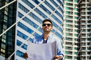 engineers man planning work activities under construction building site.