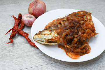 Close view of fish head sambal in a plate