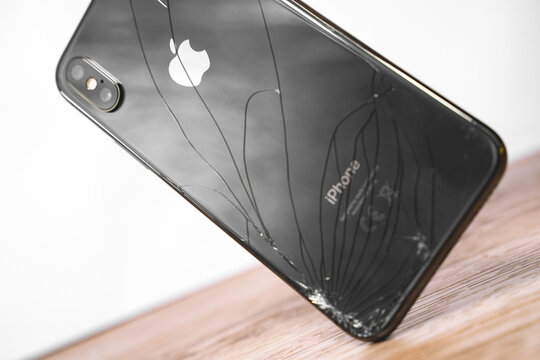 April 11, 2020, Rostov-on-Don, Russia: iPhone Ten X with broken display drop to the floor. Modern smartphone with damaged glass screen. Device needs repair