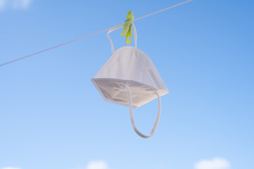 Mask hanging on clothesline