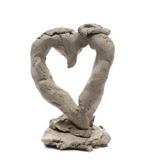 Grey modelling clay shaped in heart sculpture isolated on white background