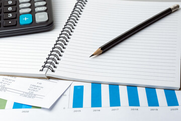 Notebook, Pencil And Calculator On Financial Report - Business Accounting Concept