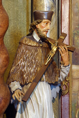 Obraz premium Saint John the Nepomuk statue on the altar of Saint Joseph in the parish church Visitation of the Virgin Mary in Garesnica, Croatia