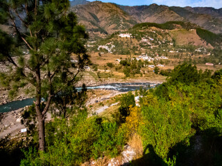 river flow in lush green valley