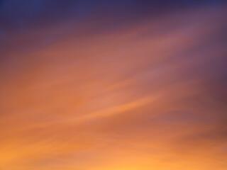 Beautiful sunset gradient from magenta sky to peachy clouds. Sunrise sky perfect for background and backdrop design.