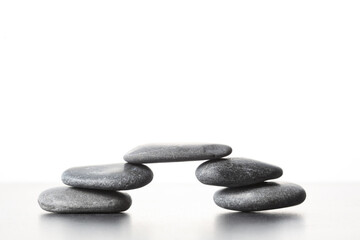 piled zen stone  create a bridge isolated on white background with copy space for your text