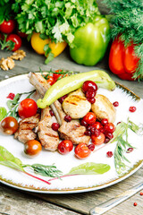 Restaurant dish on a wooden background. Azerbaijani shish kebab and grilled ribs.